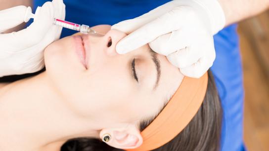 Women getting liquid rhinoplasty